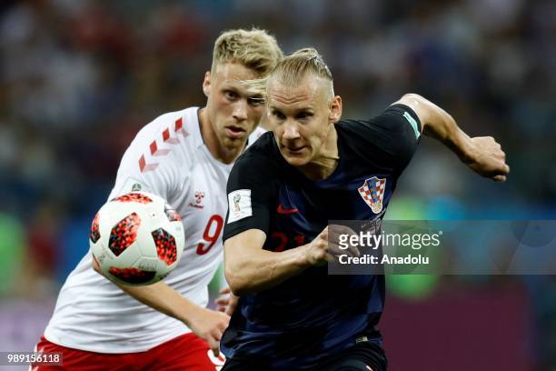Domagoj Vida of Croatia in action against Nicolai Jorgensen of Denmark during the 2018 FIFA World Cup Russia Round of 16 match between Croatia and...