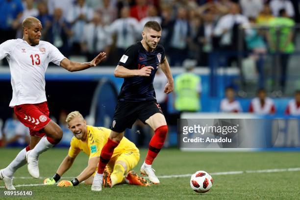 Kasper Schmeichel of Denmark in action against Ante Rebic of Croatia during the 2018 FIFA World Cup Russia Round of 16 match between Croatia and...