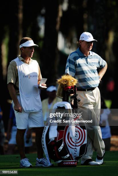 Ernie Els of South Africa waits with his caddie Dan Quinn during the second round of THE PLAYERS Championship held at THE PLAYERS Stadium course at...