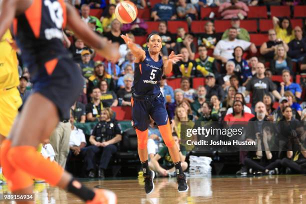 Jasmine Thomas of the Connecticut Sun handles the ball against the Seattle Storm on July 1, 2018 at Key Arena in Seattle, Washington. NOTE TO USER:...