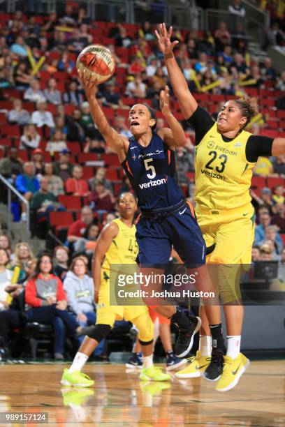 Jasmine Thomas of the Connecticut Sun shoots the ball against the Seattle Storm on July 1, 2018 at Key Arena in Seattle, Washington. NOTE TO USER:...
