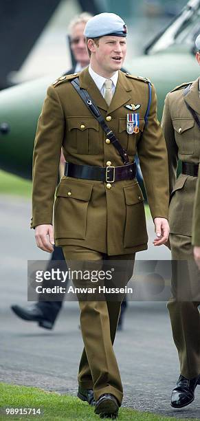 Prince Harry wears his Army Flying Corps blue beret following his pilot course graduation at the Army Aviation Centre on May 7, 2010 in Andover,...