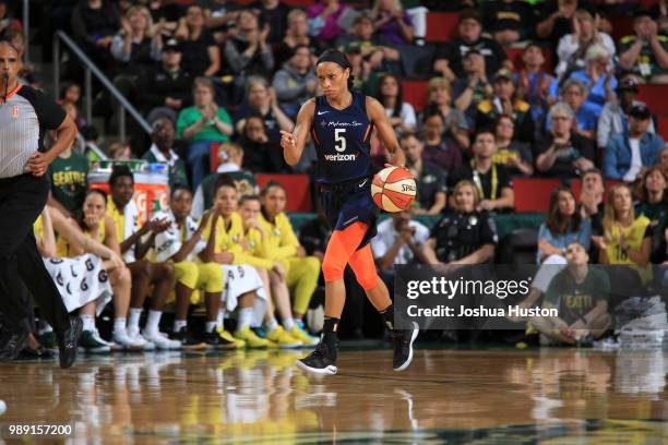 Jasmine Thomas of the Connecticut Sun handles the ball against the Seattle Storm on July 1, 2018 at Key Arena in Seattle, Washington. NOTE TO USER:...