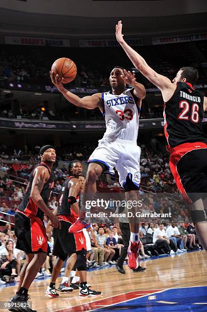 Willie Green of the Philadelphia 76ers makes a layup against Hedo Turkoglu of the Toronto Raptors during the game at Wachovia Center on April 3, 2010...