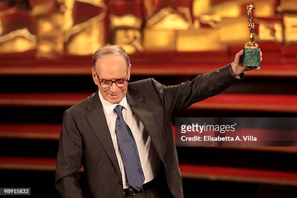 Ennio Morricone holds the 'David Di Donatello' for Best Soundtrack for 'Baaria' during the Italian Movie Awards on May 7, 2010 in Rome, Italy.