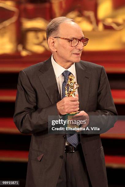 Ennio Morricone holds the 'David Di Donatello' for Best Soundtrack for 'Baaria' during the Italian Movie Awards on May 7, 2010 in Rome, Italy.
