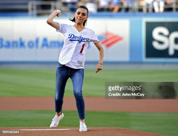 Actress Mila Kunis seen throwing out the first pitch in Los Angeles Dodgers against Colorado Rockies at Dodger Stadium on June 29, 2018 in Los...
