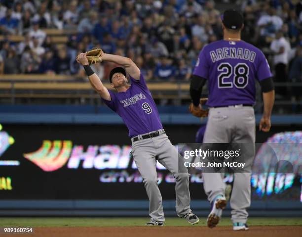 LeMahieu of the Colorado Rockies catches an infield fly hit by Enrique Hernandez of the Los Angeles Dodgers in the fourth inning at Dodger Stadium on...