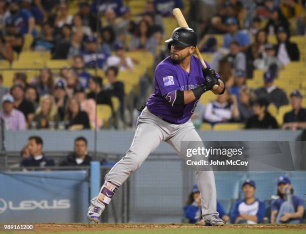 Carlos Gonzalez of the Colorado Rockies takes a swing at a pitch from the Los Angeles Dodgers in the ninth inning at Dodger Stadium on June 29, 2018...