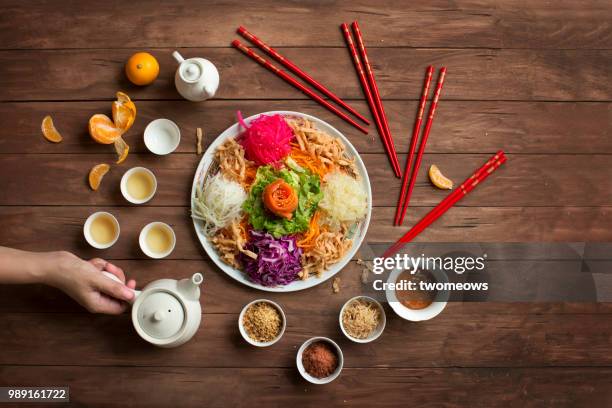 chinese new year food, raw fish salad “yusheng”. - fish food imagens e fotografias de stock