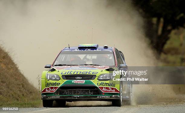 Mikko Hirvonen and Jarmo Lehtinen of Finland drive their Ford Focus RS WRC during stage 12 of the WRC Rally of New Zealand on the Te Akau Coast on...