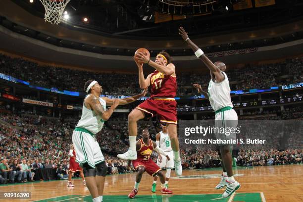 Anderson Varejao of the Cleveland Cavaliers shoots against Rasheed Wallace and Kevin Garnett of the Boston Celtics in Game Three of the Eastern...