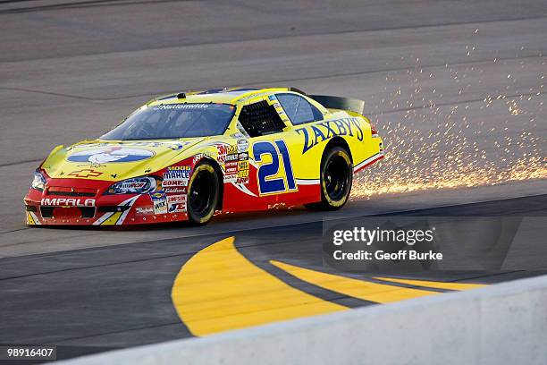 Stream of sparks shoot out the back of the Zaxby's Chevrolet, driven by Clint Bowyer, during the NASCAR Nationwide series Royal Purple 200 presented...