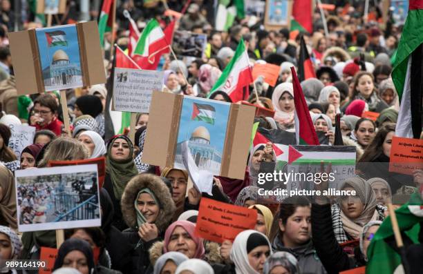 Palestinians protest against the recognition of Jerusalem as Irsael's capital by the USA and carry with them images of the Dome of the Rock and...