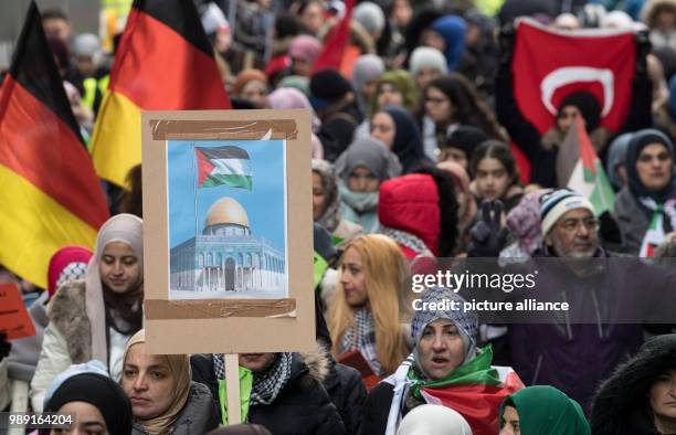 Palestinians protest against the recognition of Jerusalem as Irsael's capital by the USA and carry with them images of the Dome of the Rock and...