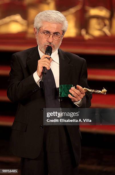 Marco Dentici holds the 'David Di Donatello' for Best Set Designer for 'Vincere' during the Italian Movie Awards ceremony on May 7, 2010 in Rome,...