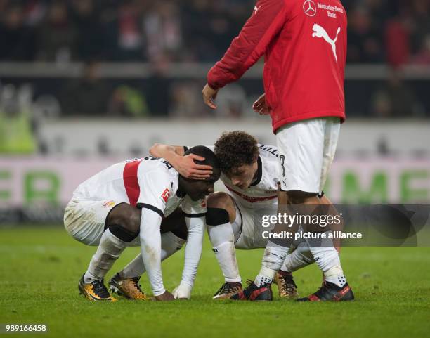 Stuttgart's Benjamin Pavard consoles Chadrac Akolo after their 0-1 loss of the German Bundesliga soccer match between VfB Stuttgart and Bayern Munich...