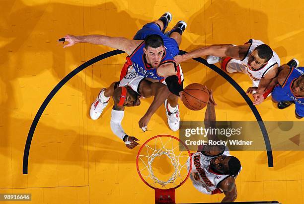 Nick Collison of the Oklahoma City Thunder goes up for a rebound against Corey Maggette, Stephen Curry and Reggie Williams of the Golden State...