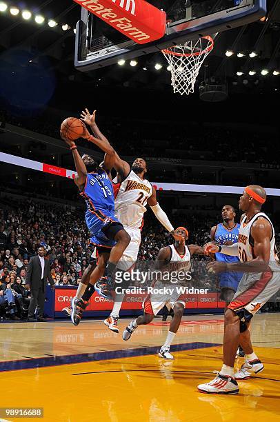 James Harden of the Oklahoma City Thunder goes up for a shot against Ronny Turiaf of the Golden State Warriors during the game at Oracle Arena on...