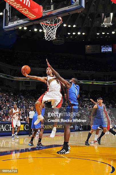 Monta Ellis of the Golden State Warriors shoots a layup against Serge Ibaka of the Oklahoma City Thunder during the game at Oracle Arena on April 11,...