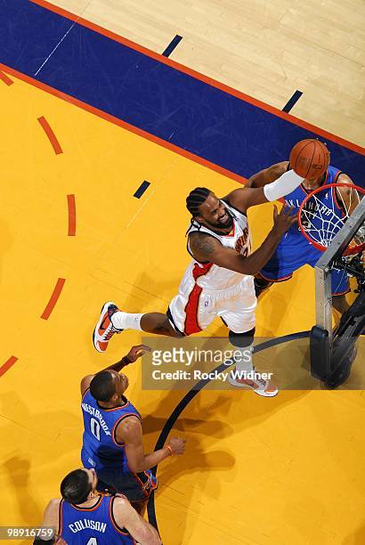 Ronny Turiaf of the Golden State Warriors shoots a layup against Russell Westbrook, Thabo Sefolosha and Nick Collison of the Oklahoma City Thunder...