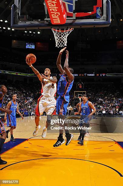 Monta Ellis of the Golden State Warriors shoots a layup against Serge Ibaka of the Oklahoma City Thunder during the game at Oracle Arena on April 11,...