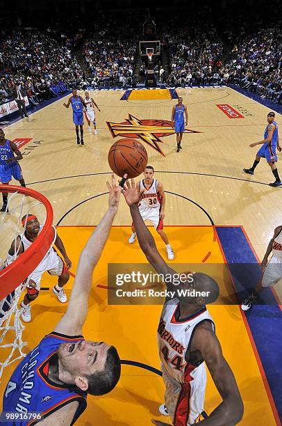 Anthony Tolliver of the Golden State Warriors rebounds against Nick Collison of the Oklahoma City Thunder during the game at Oracle Arena on April...