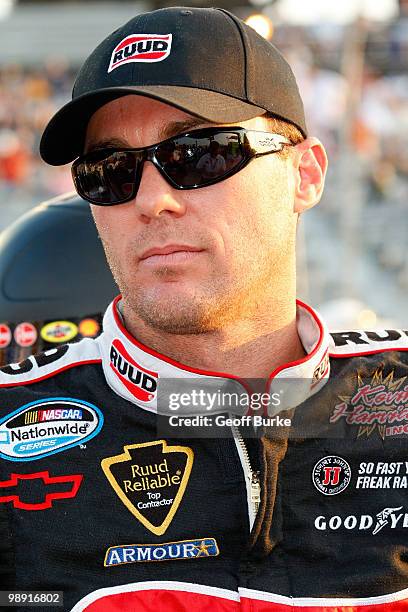 Kevin Harvick, driver of the Rheem Ruud Chevrolet, looks on from the grid prior to the start of the NASCAR Nationwide series Royal Purple 200...