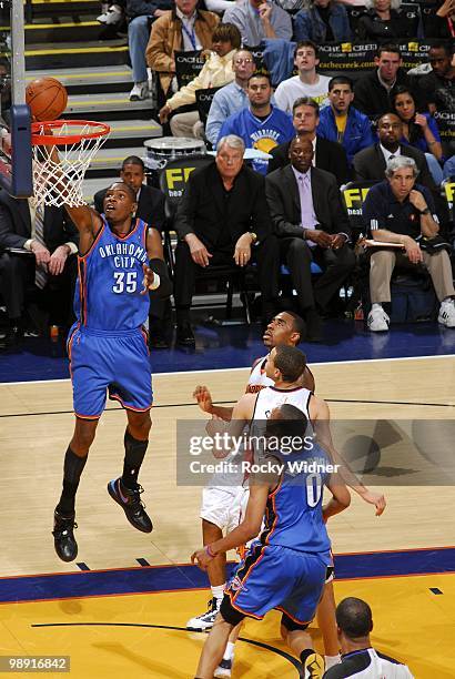 Kevin Durant of the Oklahoma City Thunder shoots a layup during the game against the Golden State Warriors at Oracle Arena on April 11, 2010 in...