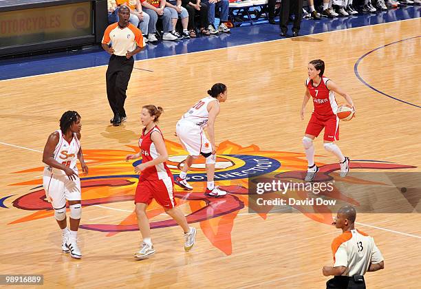 Agata Gajda of the Polish Women's National team dribbles the basketball down the court against Kara Lawson of the Connecticut Sun during the...
