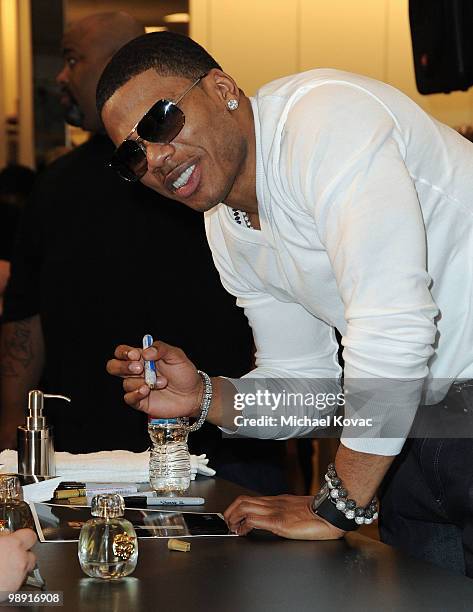 Rapper Nelly signs autographs at the celebration of his new "Apple Bottom" Collection at Macy's on May 7, 2010 in Culver City, California.