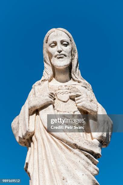 white statue of jesus christ outside the chapel of virgen de la pena, mijas, andalusia, spain - la virgen stock pictures, royalty-free photos & images
