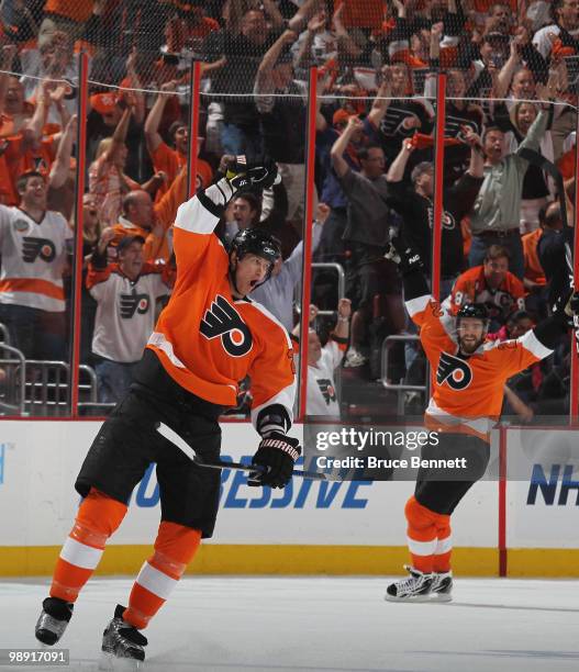 Chris Pronger and Ville Leino and of the Philadelphia Flyers celebrate Leino's goal in the third period against the Boston Bruins in Game Four of the...