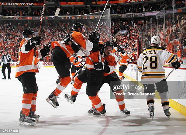 Simon Gagne of the Philadelphia Flyers scores at 14:40 of overtime to defeat the Boston Bruins in Game Four of the Eastern Conference Semifinals...