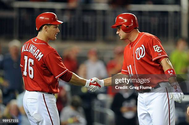 Ryan Zimmerman of the Washington Nationals celebrates with Josh Willingham after hitting a home run in the sixth inning against the Florida Marlins...