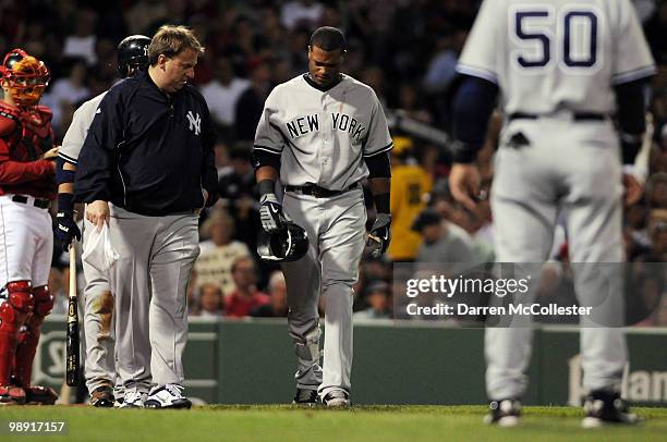 Robinson Cano of the New York Yankees is looked to after being hit by a pitch during the sixth inning against the Boston Red Sox May 7, 2010 at...