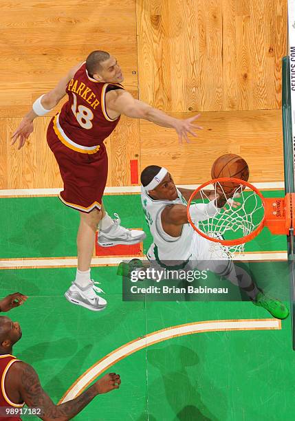 Rajon Rondo of the Boston Celtics lays the ball in the basket against Anthony Parker of the Cleveland Cavaliers in Game Three of the Eastern...