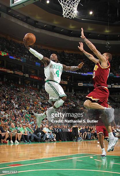 Nate Robinson of the Boston Celtics shoots against Delonte West of the Cleveland Cavaliers in Game Three of the Eastern Conference Semifinals during...