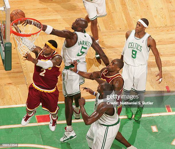 Mo Williams of the Cleveland Cavaliers shoots against Kevin Garnett of the Boston Celtics as Rajon Rondo, Kendrick Perkins and Antawn Jamison vie for...