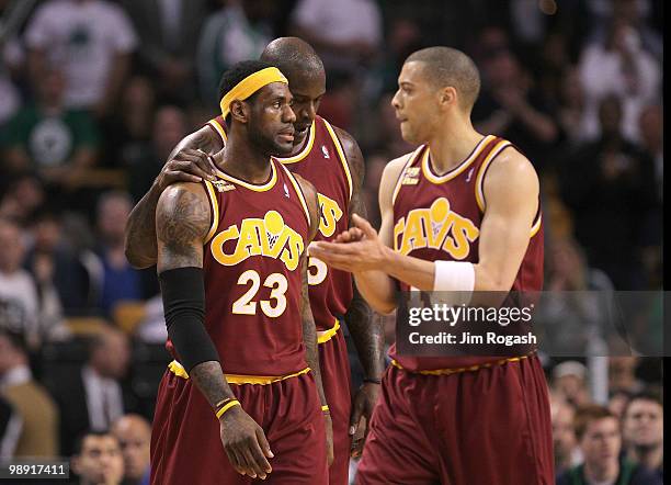 LeBron James, Shaquille O'Neal and Anthony Parker of the Cleveland Cavaliers take a breather during a game against the Boston Celtics during Game...