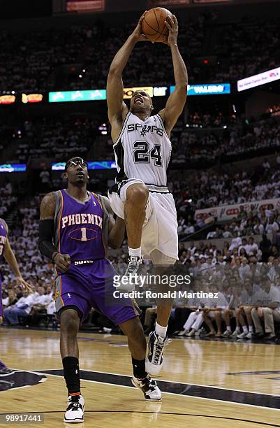 Forward Richard Jefferson of the San Antonio Spurs takes a shot against Amar'e Stoudemire of the Phoenix Suns in Game Three of the Western Conference...