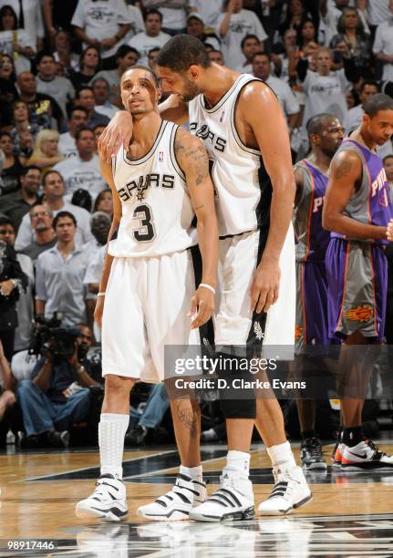 Tim Duncan of the San Antonio Spurs talks to George Hill after a hard foul from the Phoenix Suns in Game Three of the Western Conference Semifinals...