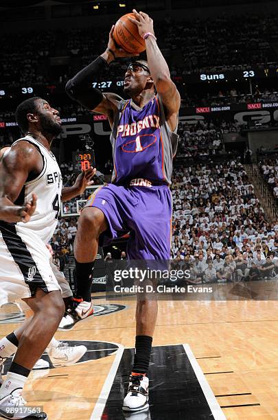 Amar'e Stoudemire of the Phoenix Suns shoots against DeJuan Blair of the San Antonio Spurs in Game Three of the Western Conference Semifinals during...