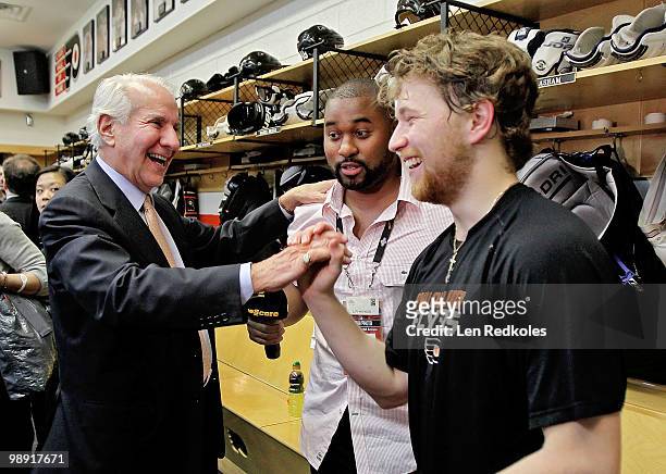 Chairman of the Philadelphia Flyers Ed Snider congratulates Claude Giroux after defeating the Boston Bruins 5-4 in overtime in Game Four of the...