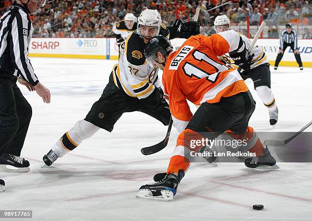 Blair Betts of the Philadelphia Flyers wins a faceoff against Patrice Bergeron of the Boston Bruins in Game Four of the Eastern Conference Semifinals...