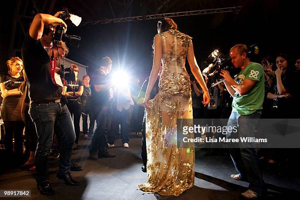Model Alexandra Agoston poses backstage for the media at the Alex Perry 'Arabian Princess' collection show during Rosemount Australian Fashion Week...