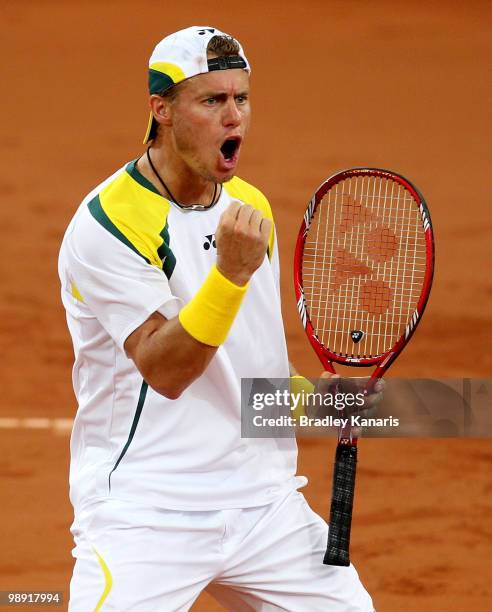 Lleyton Hewitt of Australia pumps his fist as he celebrates winning a point during his doubles match against Takao Suzuki and Go Soeda of Japan...