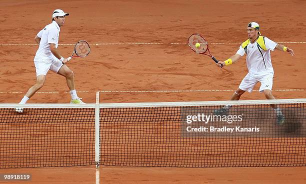 Lleyton Hewitt of Australia plays a forehand during his doubles match against Takao Suzuki and Go Soeda of Japan during the match between Australia...