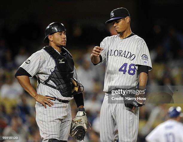 Esmil Rogers and Miguel Olivo of the Colorado Rockies reacts after allowing three runs to the Los Angeles Dodgers during the fifth inning at Dodger...