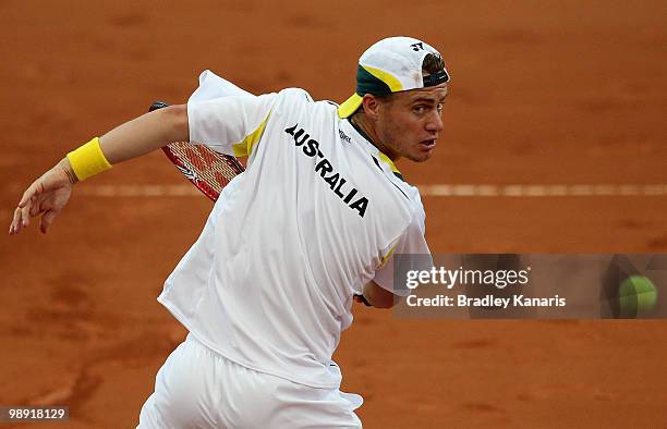 Lleyton Hewitt of Australia plays a backhand volley during his doubles match against Takao Suzuki and Go Soeda of Japan during the match between...